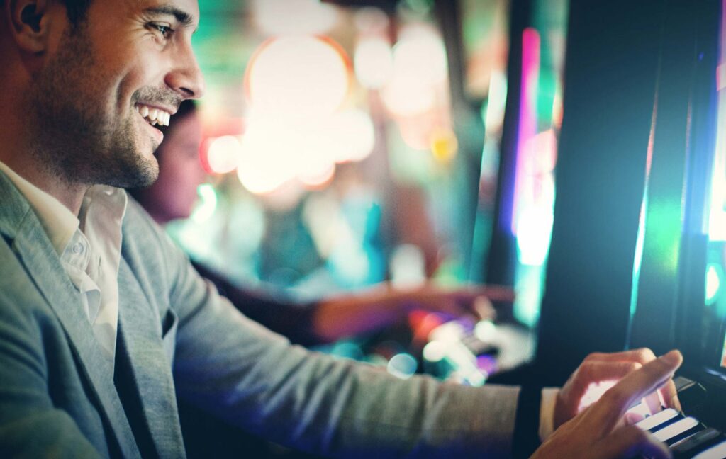 Man at slot machine